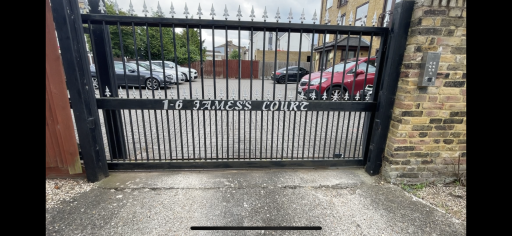 Lot: 58 - ENTIRE FREEHOLD BUILDING OF SIX FLATS, ALL LET ON ASSURED SHORTHOLD TENANCIES - outside image of the gate name plate for the building